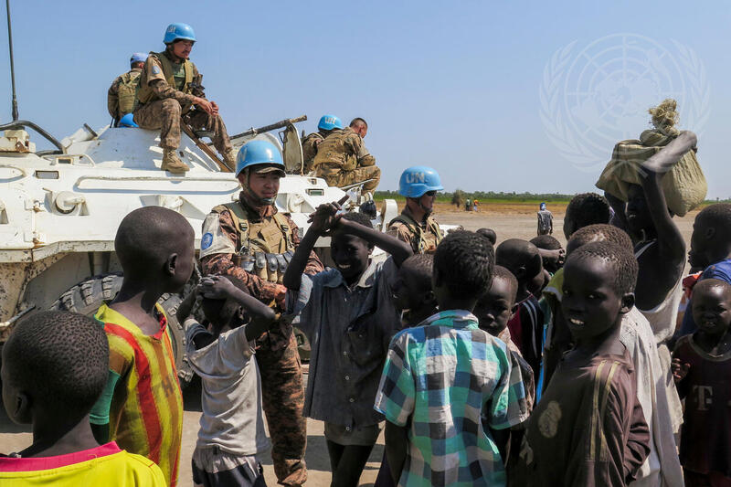 Patrolling Mongolian Peacekeepers of UNMISS with Children in Leer County
