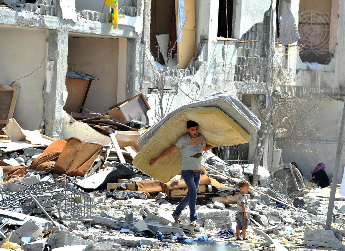 Palestinians Search through Rubble in Gaza