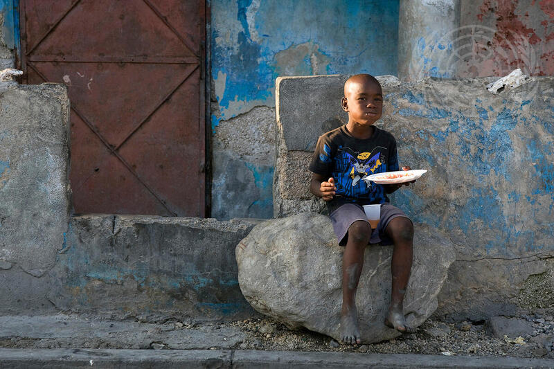 A Local Youth Enjoys Meal during Campaign Against Life-like Toy Guns