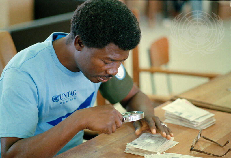 UNTAG Worker Verifies aTendered Ballot at Windhoek Election Centre