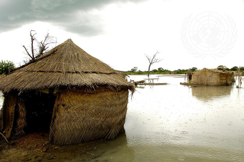 Mud Houses Surrounded by Floodwaters