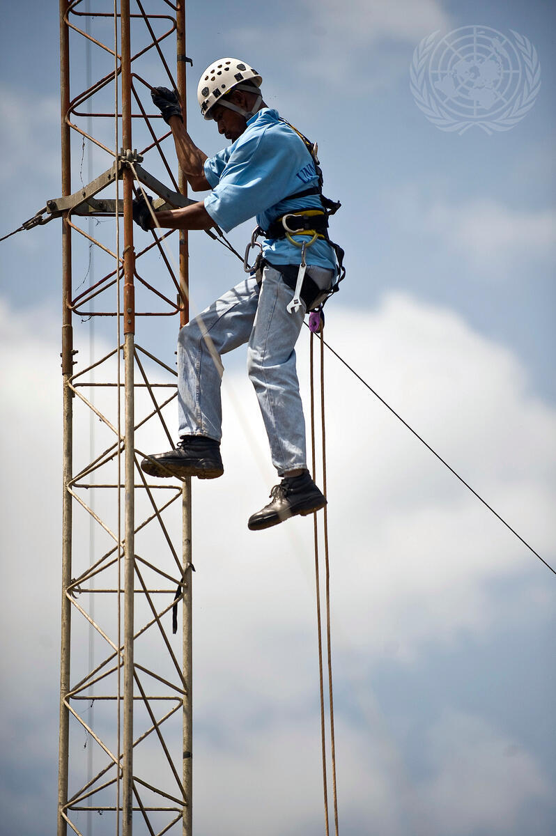 Electrical Technician Repairs Radio Tower