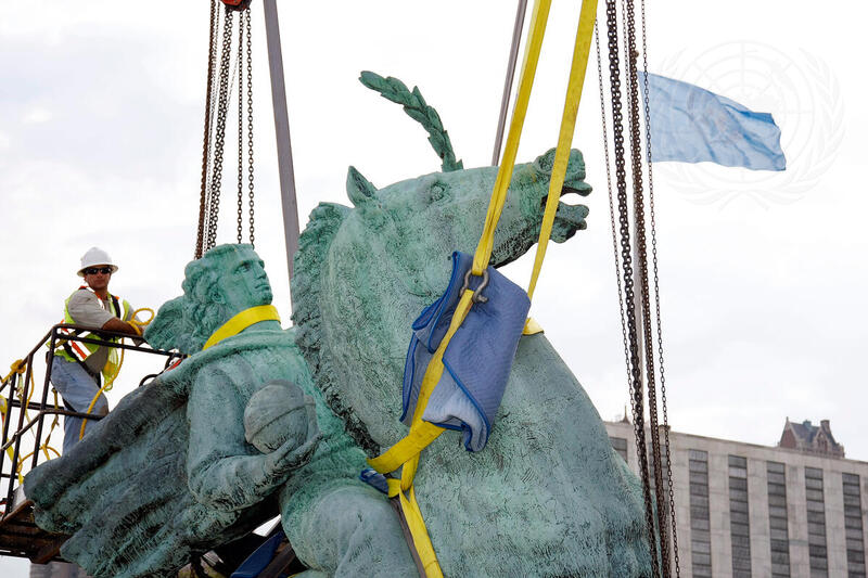 Construction Worker Removes Peace Monument Sculpture from North Lawn