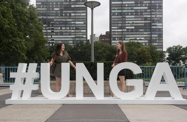 Visitors to UNHQ Pose at UNGA Sign at Visitors Plaza