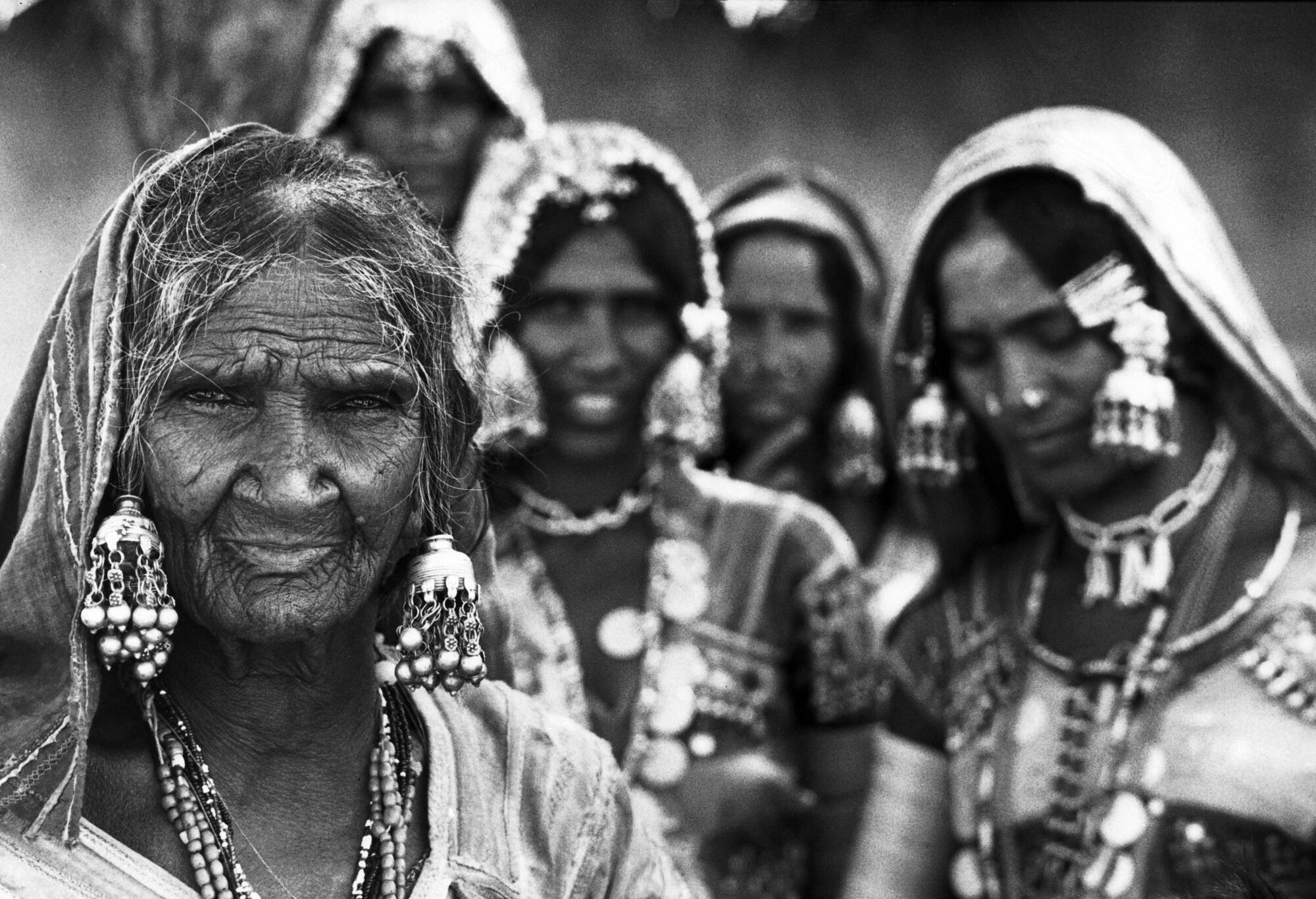 Rising life expectancies and declining birth rates throughout the world are creating an increasing proportion of old people to young. By the year 2000 there will be nearly 600 million people over 60 years old, twice the 1970 figure. In the developing world, and to a lesser extent elsewhere, the traditional roles and support structures for elderly are being eroded by rapid social and economic change. Between 26 July and 6 August, 1982, a special UN-sponsored World Assembly on Aging will be held in Vienna to discuss the long-range future of the world's elderly. Issues on the agenda include health, housing and the environment, social welfare, income security, education and the family, and the role of the elderly in development. 

Banjara tribal women near Hyderabad, Andhra Pradesh, India. [Exact date unknown]