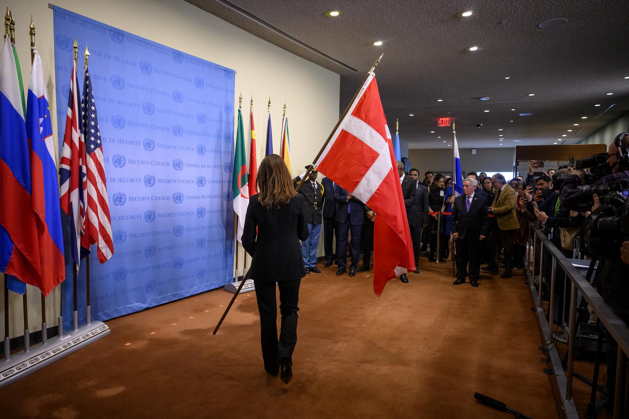 An installation ceremony of the national flags of the countries of the newly elected non-permanent members to serve on the United Nations Security Council for the 2025-2026 term is shown being held at UN Headquarters. The five new non-permanent members are Denmark, Greece, Pakistan, Panama, and Somalia.

Christina Markus Lassen, Permanent Representative of Denmark to the United Nations, installs the flag of her country.